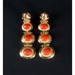 Elegant pair of earrings with three red coral balls mounted in 18k yellow gold