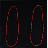 Pair of elegant red coral beaded necklaces, with sterling gold clasp