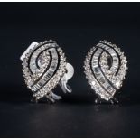 Exceptional pair of oval earrings in 18k white gold and baguette-cut and brilliant-cut diamonds