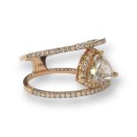 Ring in 18k rose gold with a 1ct trillion cut central diamond in a fancy pinkish brown crystal color
