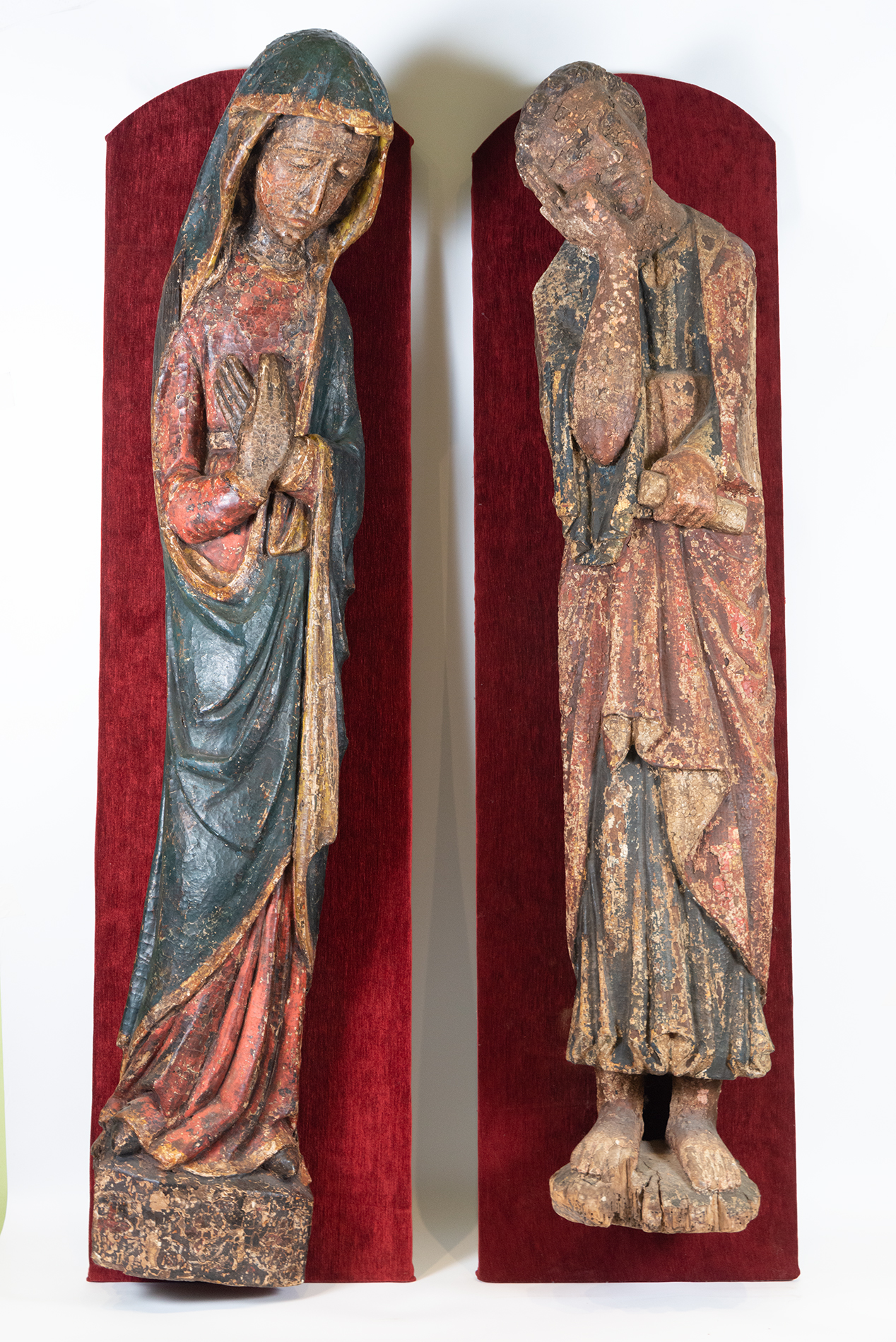 Pair of Large Romanesque Carvings representing Mary and Saint John the Evangelist, Romanesque School