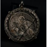 Silver oval pendant type reliquary with Engravings of the Virgin appearing to Saint Anthony and the