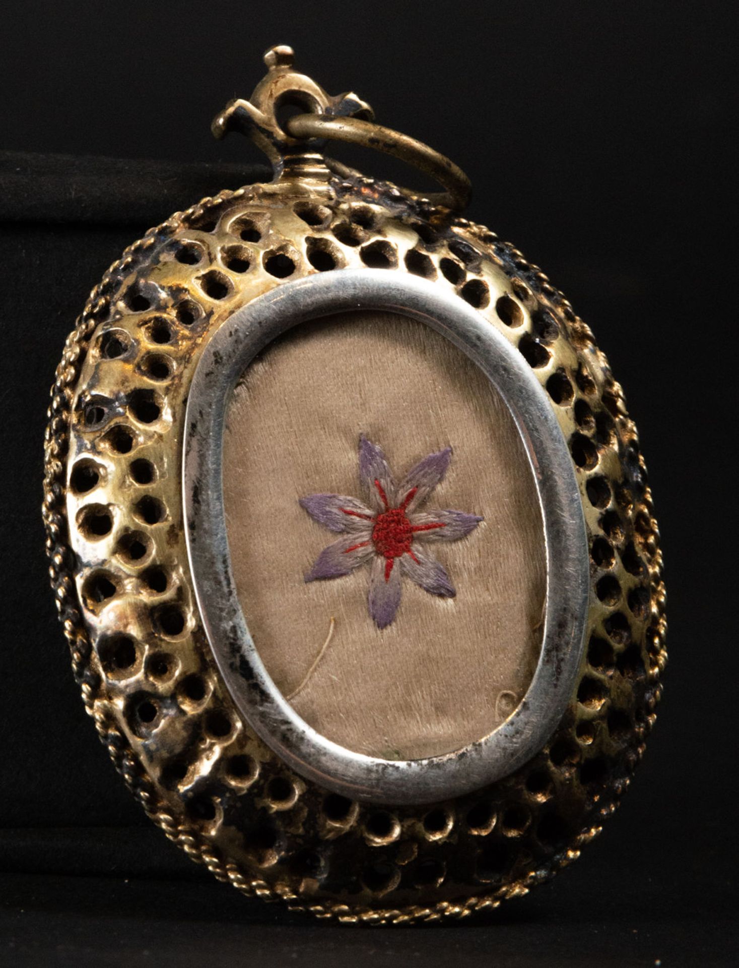 Hanging reliquary in bronze and silver of Virgin with Child and relic on the back, 17th century