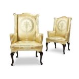 A pair of 20th century Queen Anne style mahogany wing armchairs