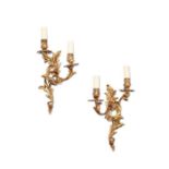 A pair of Louis XV style gilt bronze twin-light wall lights