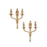 A pair of early 20th century neo-classical gilt bronze twin-light wall lights