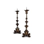 A pair of tall 19th century Renaissance Revival pressed metal pricket candlesticks