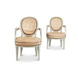 A pair of Louis XV style grey and white painted fauteuils