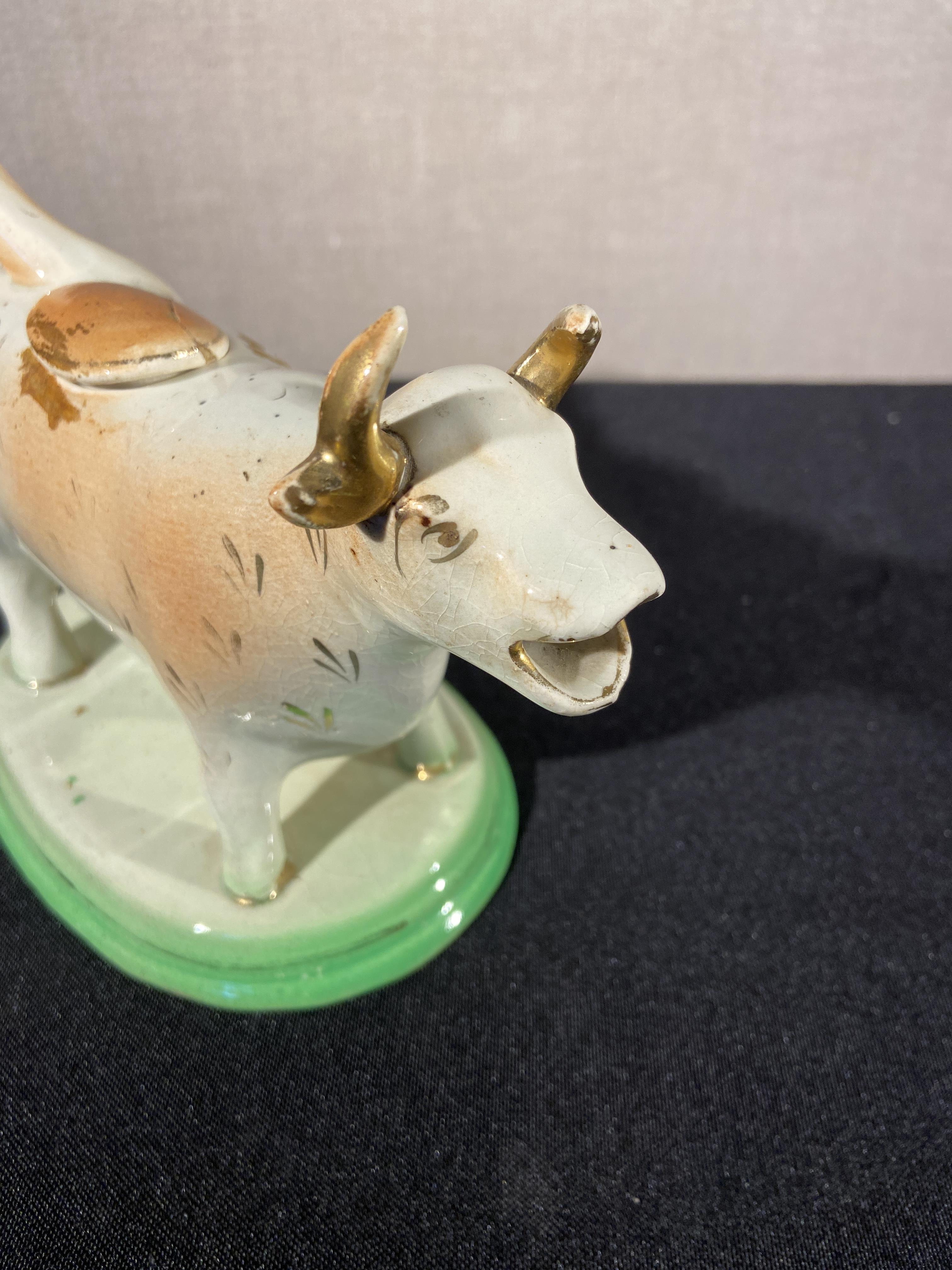 A collection of six 19th century Staffordshire cow creamers including four lustre decorated examples - Image 3 of 8