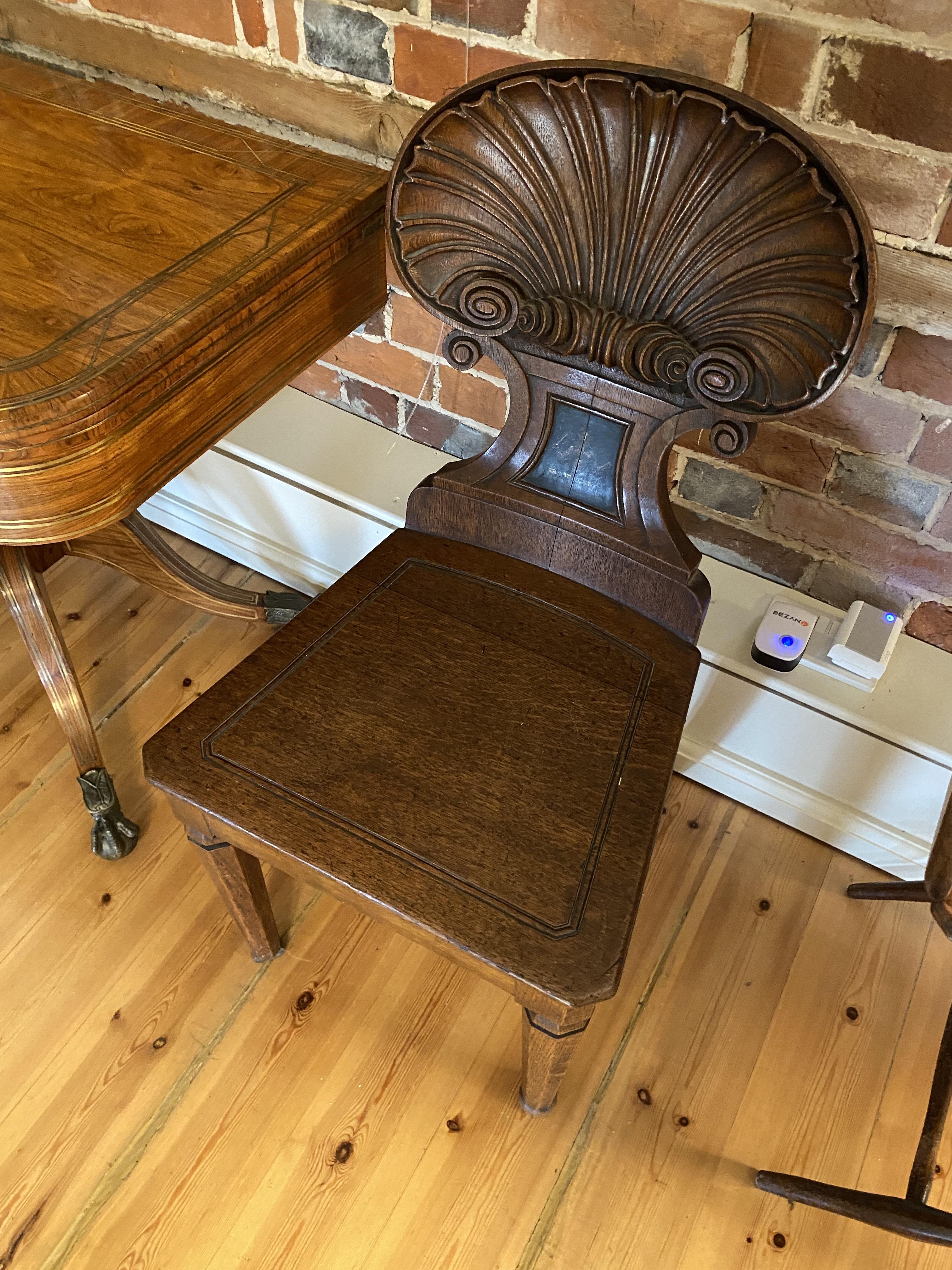 A pair of Regency carved oak shell-back hall chairs attributed to Gillows - Image 2 of 24