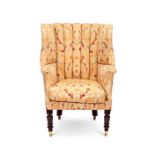 A late Regency mahogany wing armchair