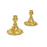 A pair of small late 19th century Louis XV style ormolu candlesticks