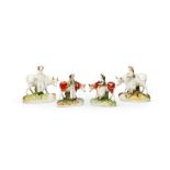 Two pairs of Staffordshire figures of farmers and milkmaids standing with cows