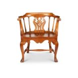 An early Victorian solid walnut armchair