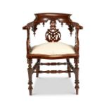 A Victorian Elizabethan revival walnut carved desk chair