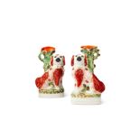 A pair of 19th century Staffordshire spaniel flatback spill vases