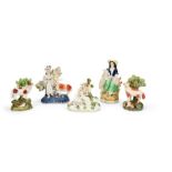 A group of 19th century Staffordshire figures of Sheep and Shepherdesses