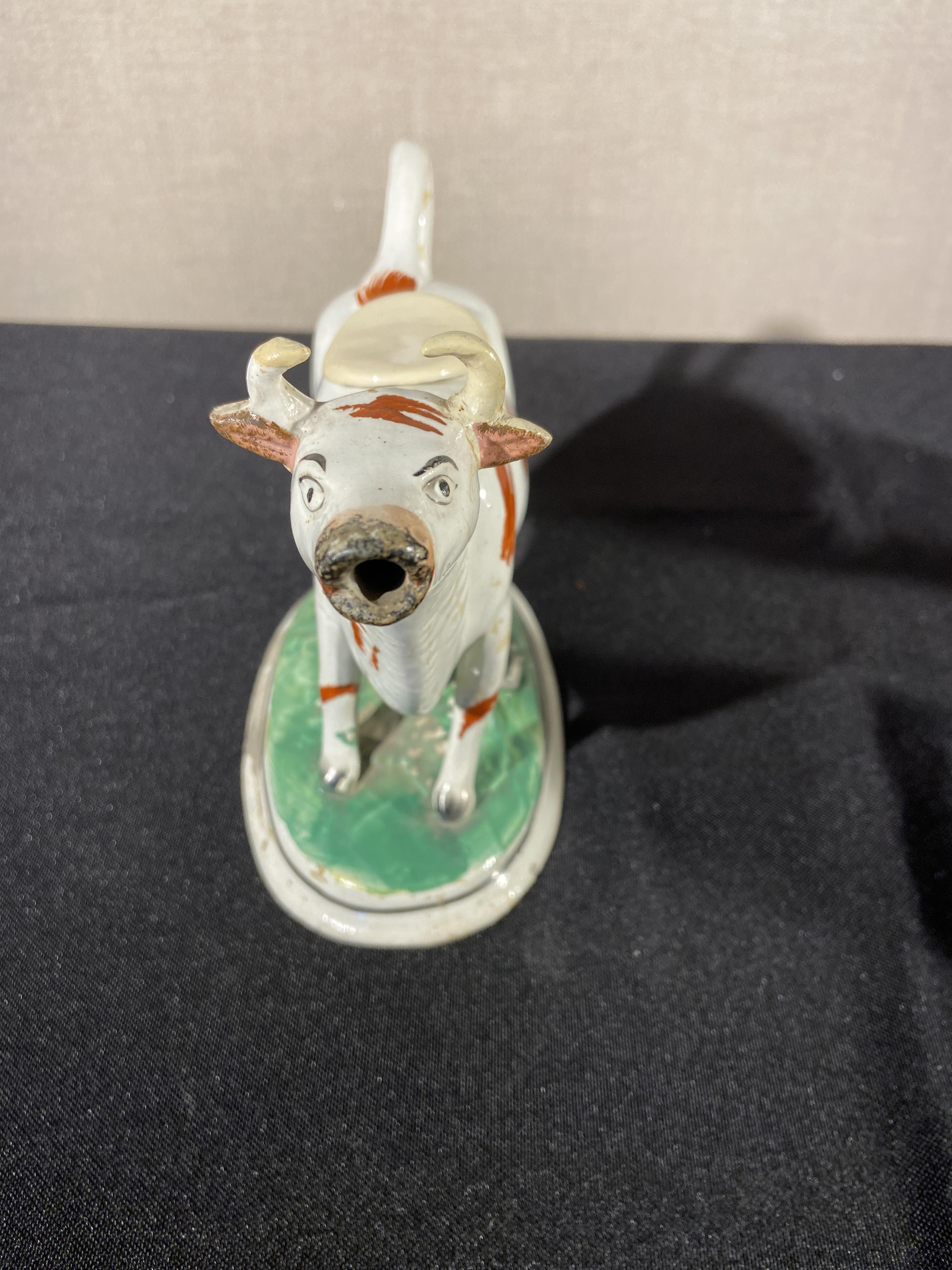 A collection of six 19th century Staffordshire cow creamers including four lustre decorated examples - Image 7 of 8