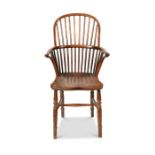 A George IV ash and elm spindle-back Windsor open armchair