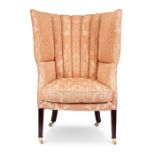 A Regency mahogany barrell shaped wing armchair