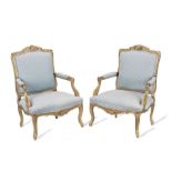 A pair of 20th century Louis XV style giltwood fauteuils