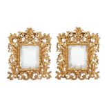 A pair of 17th century style Florentine carved gilt wood mirrors