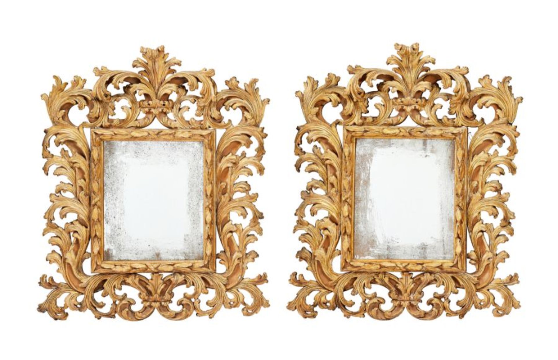 A pair of 17th century style Florentine carved gilt wood mirrors