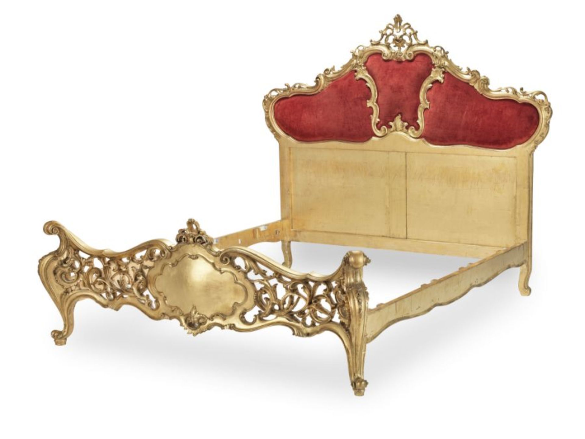 A 19th century and later rococo style carved giltwood bed