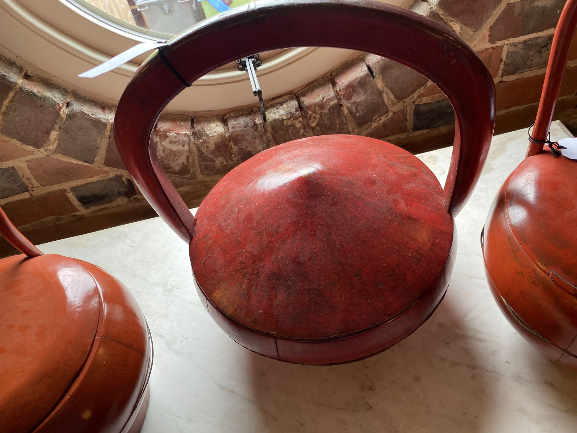 An early 20th century Chinese teak rice measure and three Chinese red lacquered rice carriers - Image 7 of 14