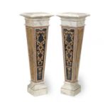 A pair of inlaid marble pedestals