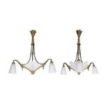 A pair of French Art Deco gilt bronze and silvered opaque glass chandeliers