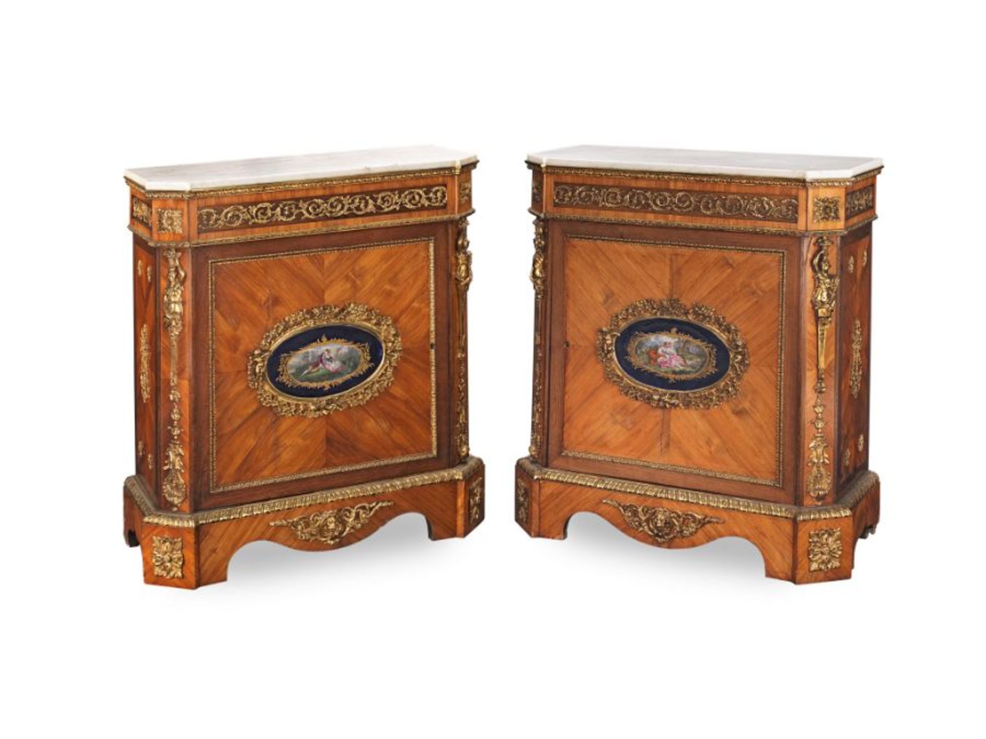 A pair of 19th century Louis XVI style kingwood and tulipwood side cabinets