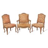 A Louis XV walnut fauteuil and pair of chaises