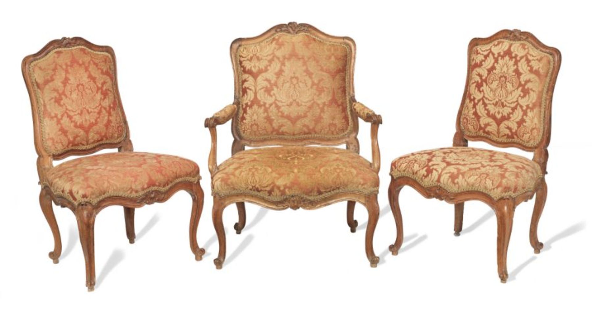 A Louis XV walnut fauteuil and pair of chaises