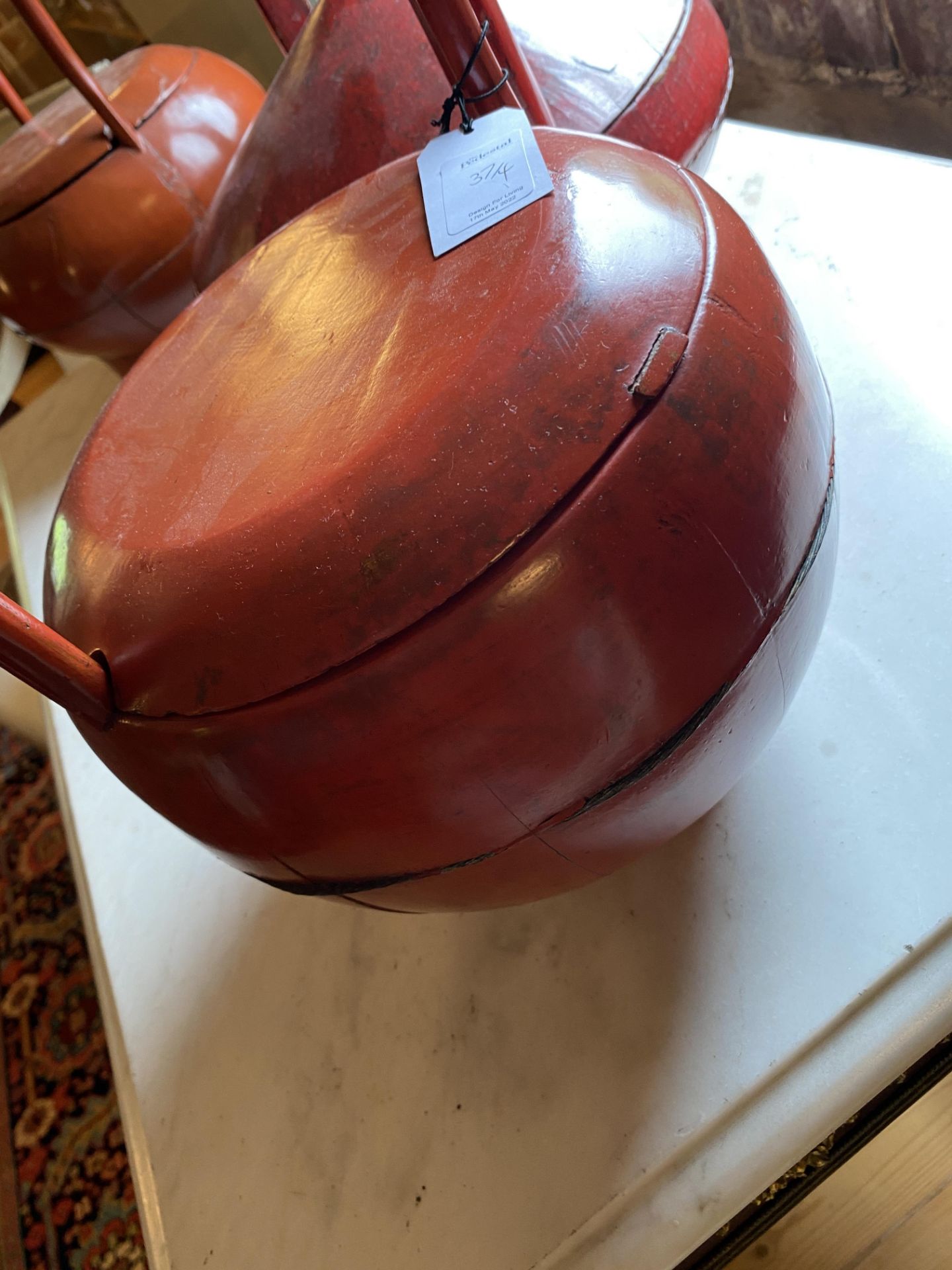 An early 20th century Chinese teak rice measure and three Chinese red lacquered rice carriers - Image 5 of 14