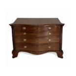 A George III mahogany serpentine chest