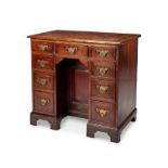 A George II oak kneehole desk