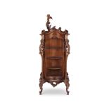 A late 19th century Italian baroque style walnut carved display cabinet