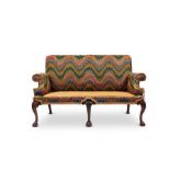 A late 19th century George II style carved mahogany two seater settee