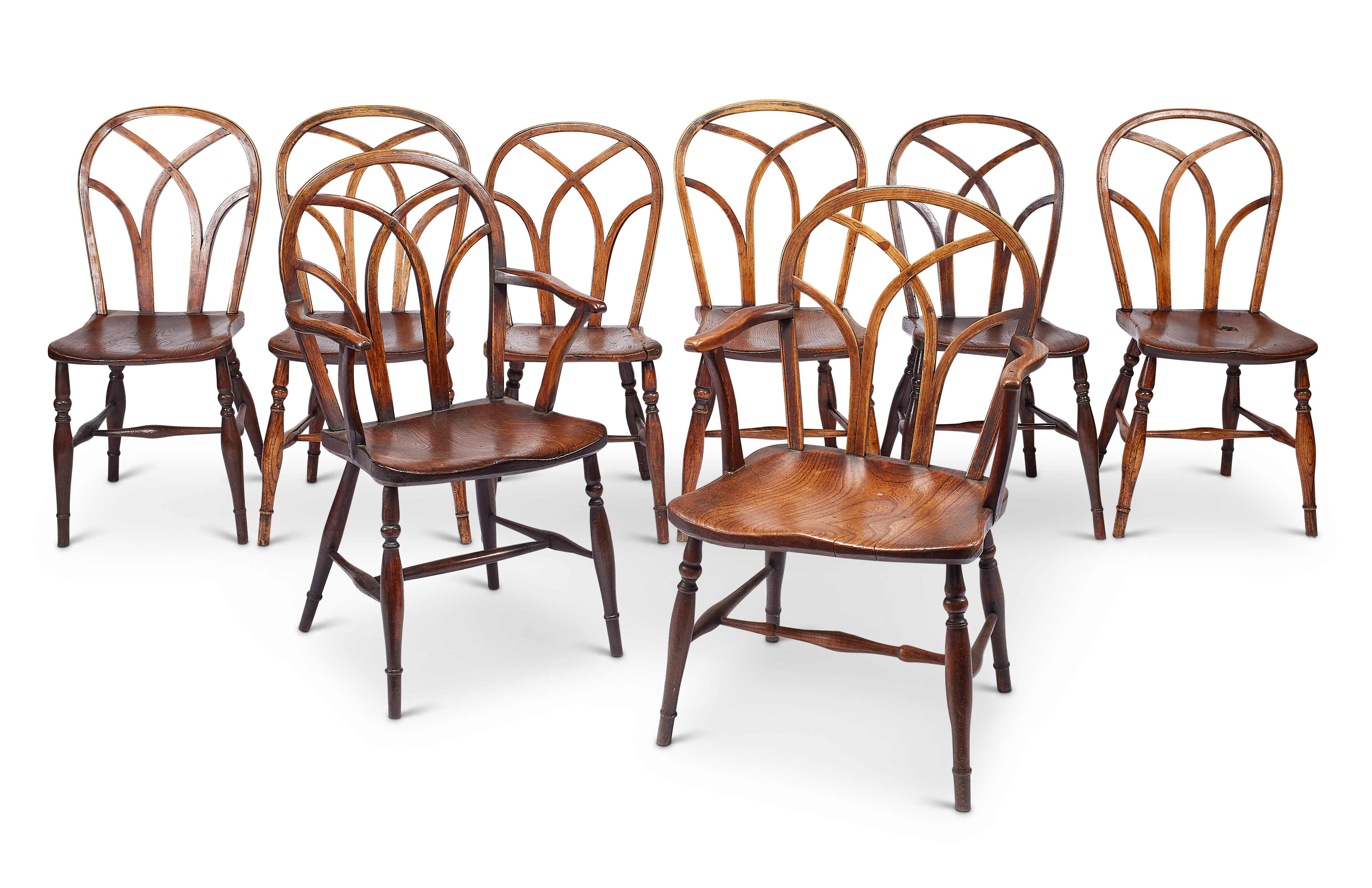A matched set of eight George IV ‘Gothic’ Windsor chairs, Buckinghamshire