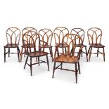 A matched set of eight George IV ‘Gothic’ Windsor chairs, Buckinghamshire