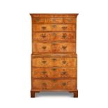 A George II walnut, crossbanded and featherbanded chest on chest