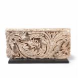 A carved limestone foliate relief, French, circa 1300