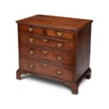 A small George II oak and inlaid chest of drawers