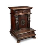 A 17th Italian Tuscan walnut carved prie dieu