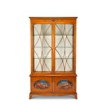 A George III style satinwood painted display cabinet