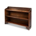 A Victorian carved oak low open bookcase