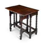 A 17th century oak single flap drop flap table
