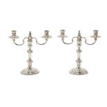 A pair of Georgian style silver twin-light candelabra by Heming & Co.Ltd, London, 1989