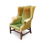 A George III mahogany wing back armchair